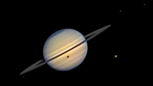 Young photographer captures a moon’s shadow on Saturn
